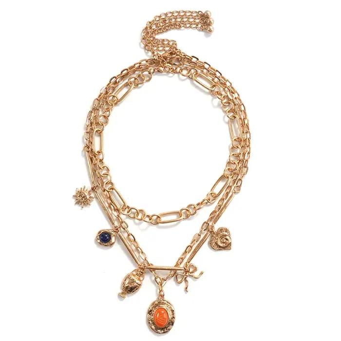 Collier superposé multi-breloques en or (style bohème éclaté) – Bijou tendance parfait pour les brun
